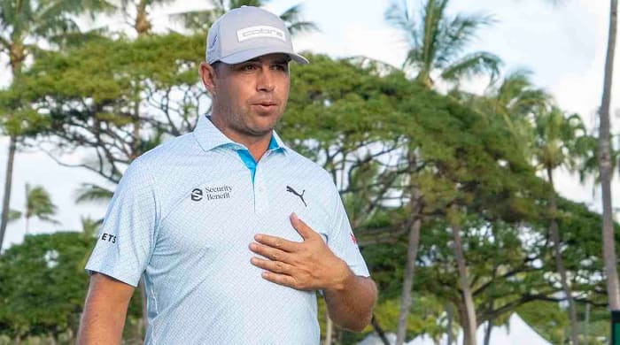 Gary Woodland reacts while walking off the 18th hole during the second round of the 2024 Sony Open in Hawaii at Waialae Country Club.